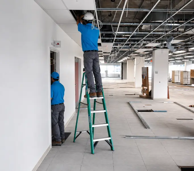 twoGuysWorkingOnDoor
